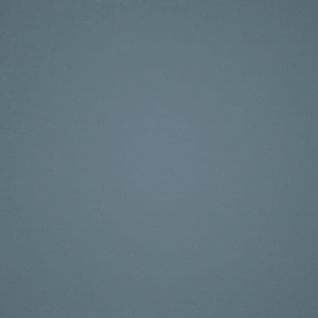 A close up of a gray background with a plain texture.