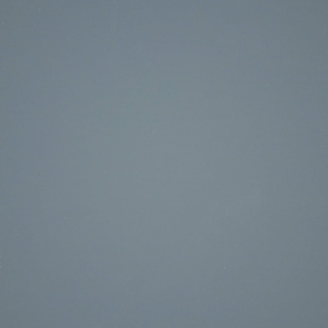 A close up of a gray background with a plain texture.