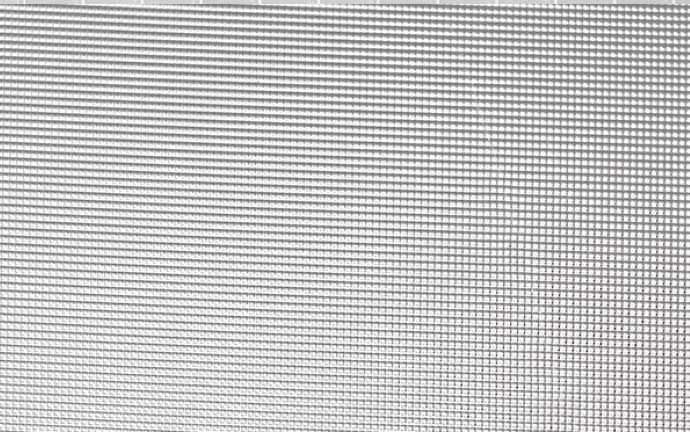 A close up of a metal mesh texture.