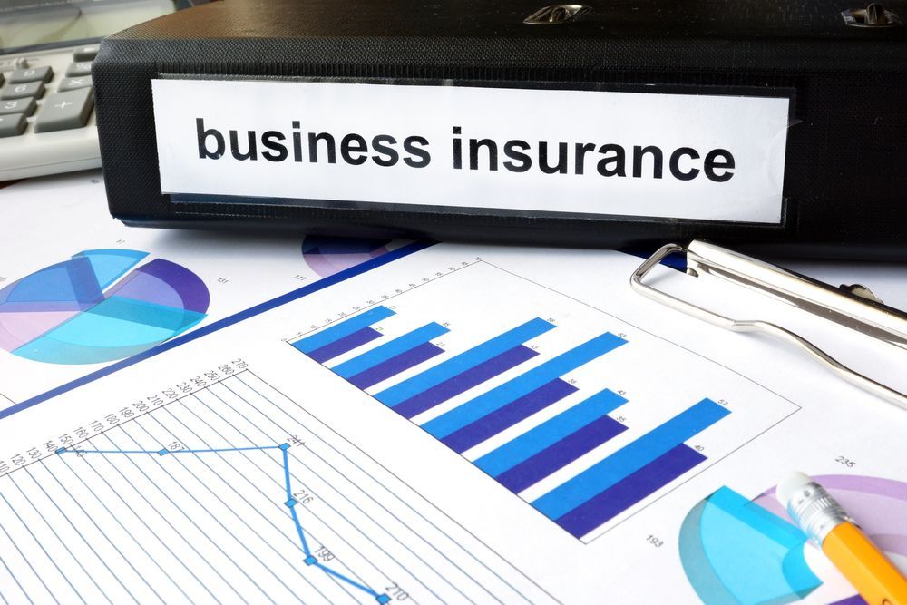 Business Insurance Binder, Charts, and Graphs on a Desk — SSP Insurance In Rockhampton City, QLD