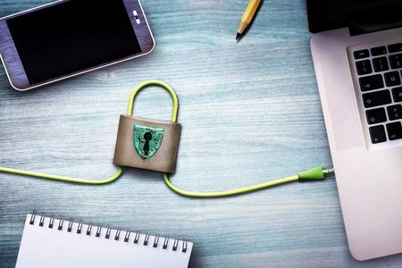 Laptop, Phone, Notepad, and Pencil Arranged Around a Padlock — SSP Insurance In Rockhampton City, QLD