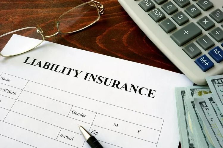Liability Insurance Form With Glasses, Calculator, Pen, and Cash — SSP Insurance In Rockhampton City, QLD