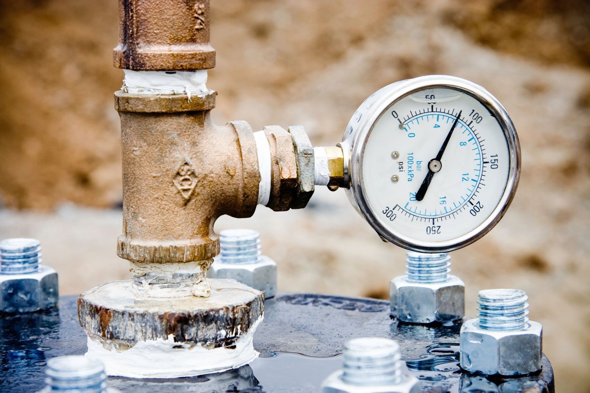 Close-up of multiple water meters and pipes, connected and in use. Backflow services Belton TX