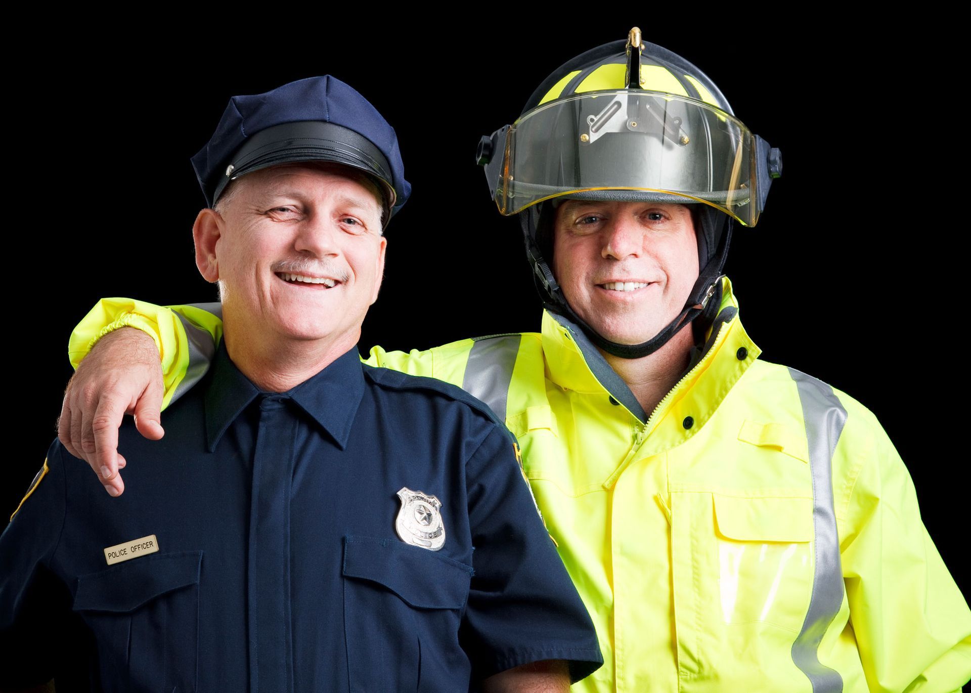 A police officer and a fireman are posing for a picture together
