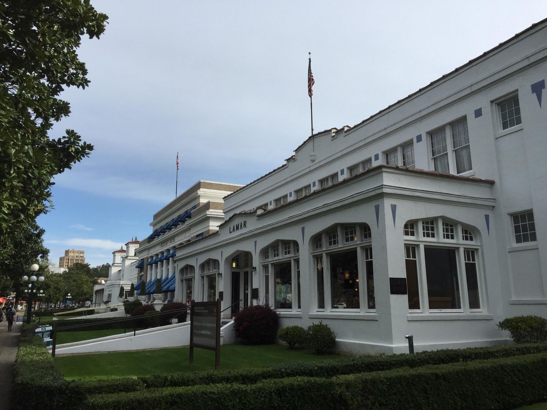 A large white building with a flag on top of it