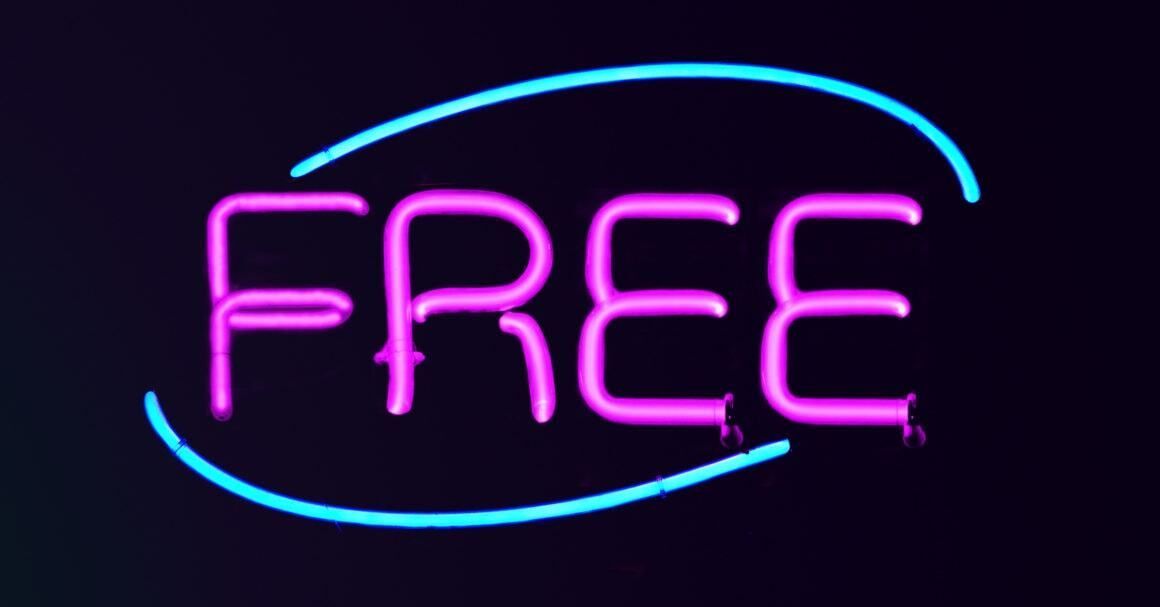 A neon sign that says `` free '' on a dark background.