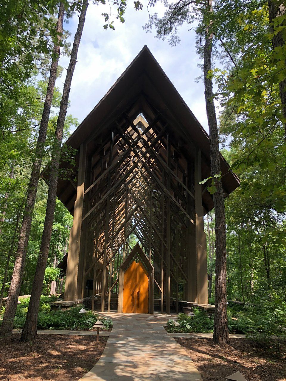 A church in the middle of a forest surrounded by trees