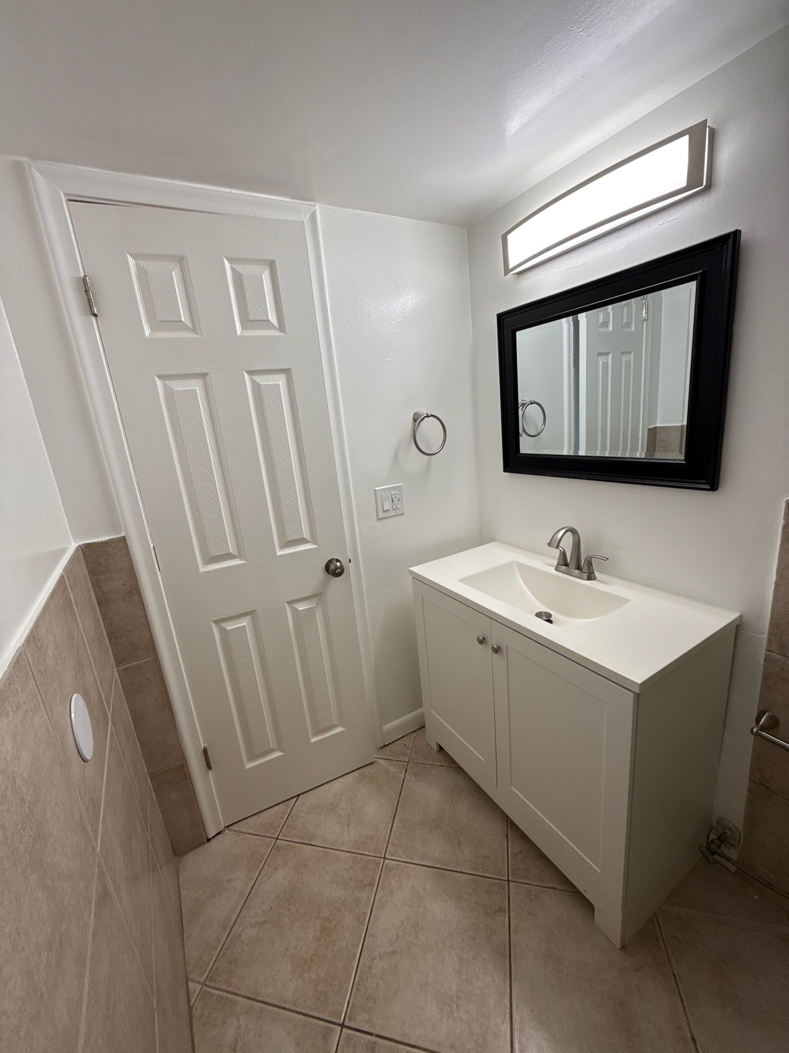 Photo of a bathroom with a vanity mirro
