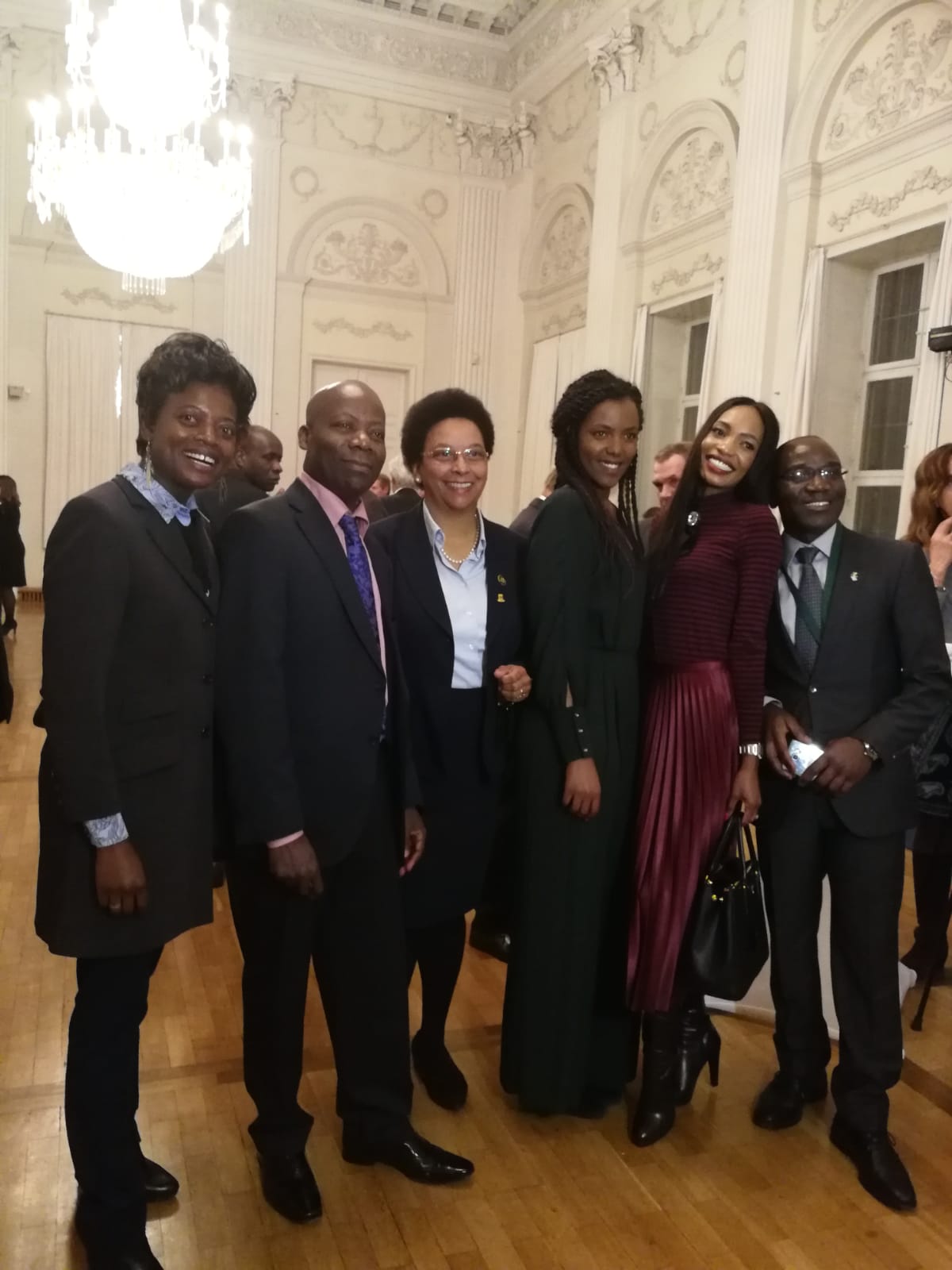 A group of people posing for a picture in a room