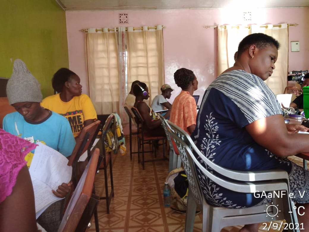 A group of people sitting in chairs in a room