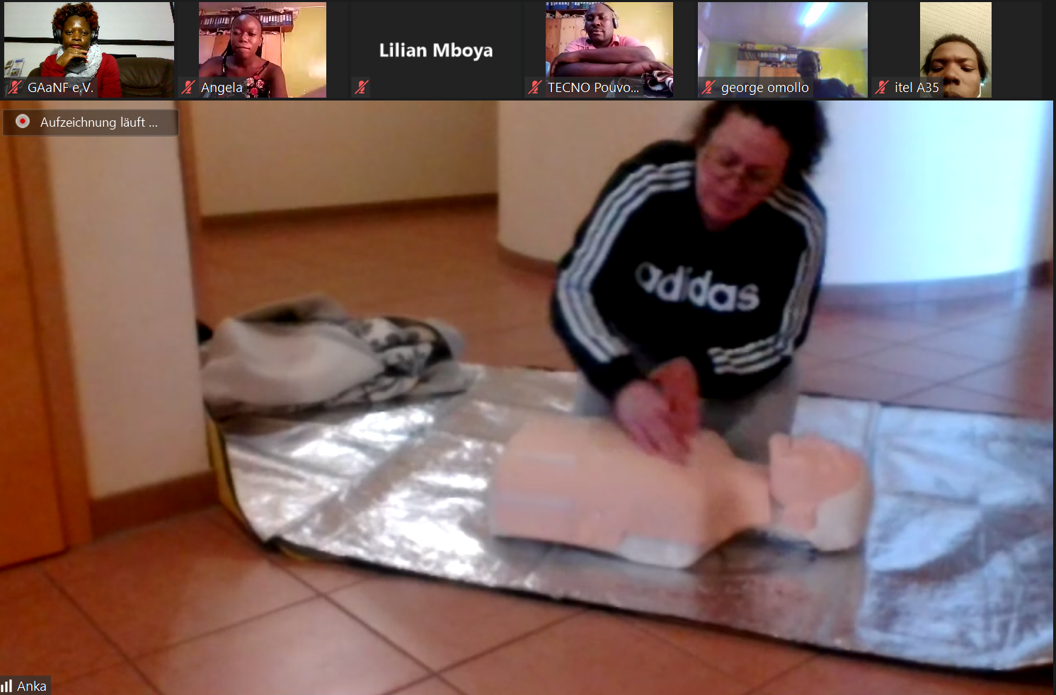 person demonstrating first aid on a doll