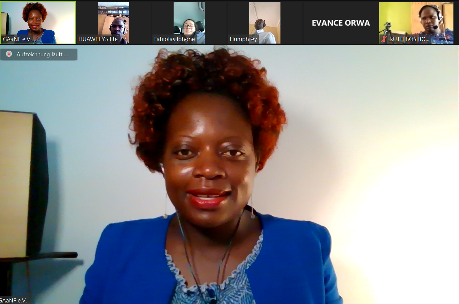 A woman with red hair is on a video call