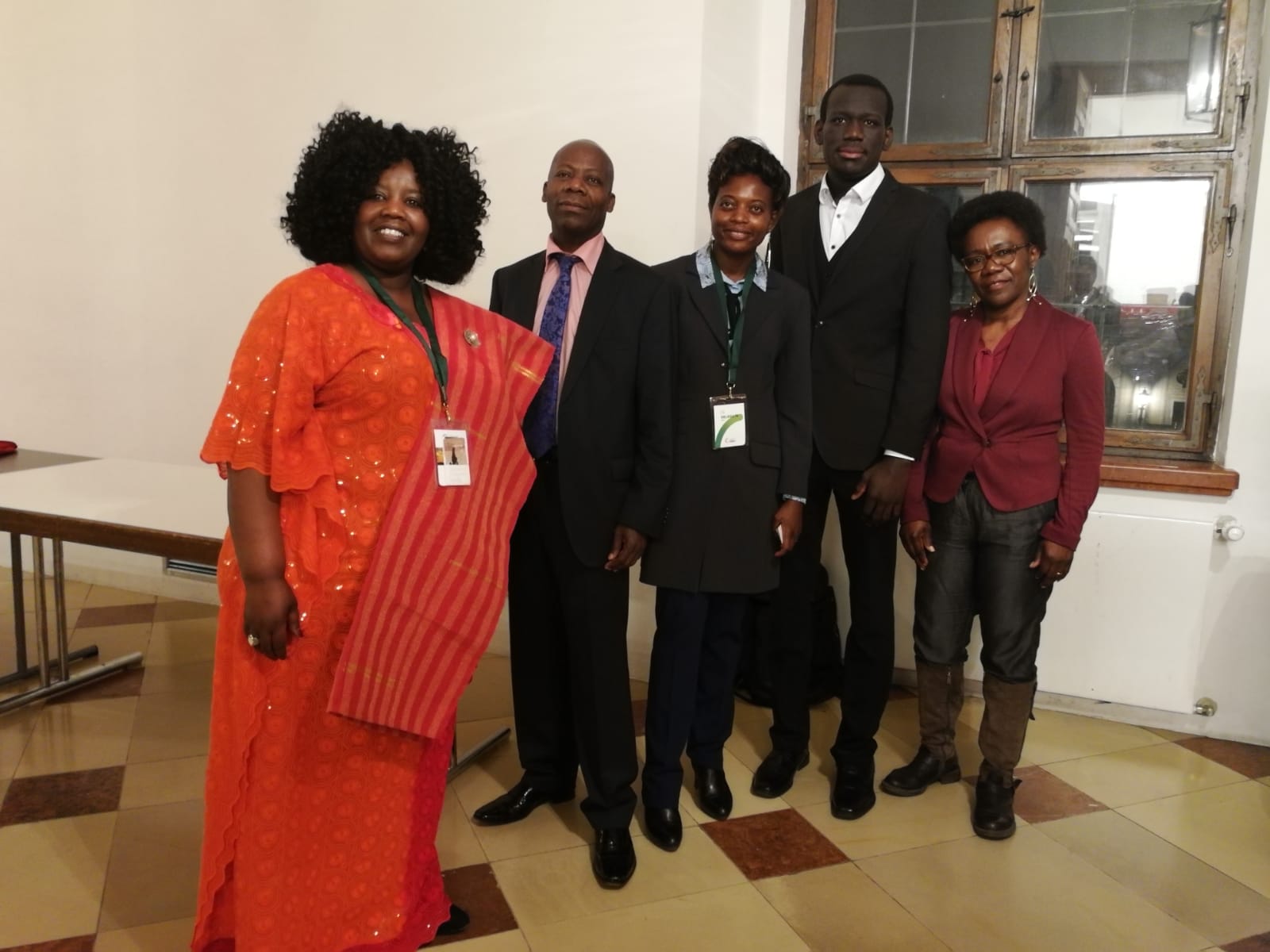 A group of people posing for a picture in a room
