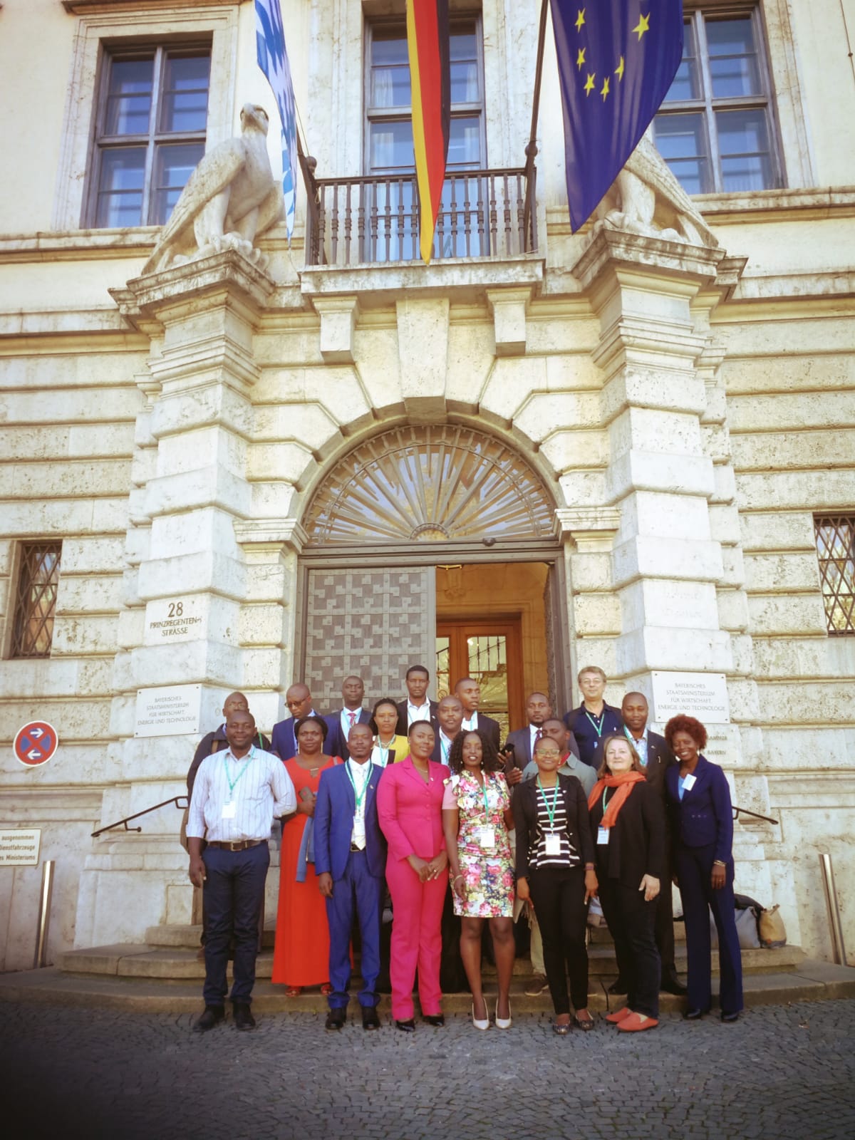 A group of people standing in front of a building