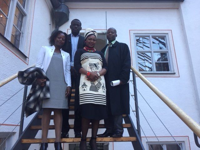 A group of people standing on a set of stairs