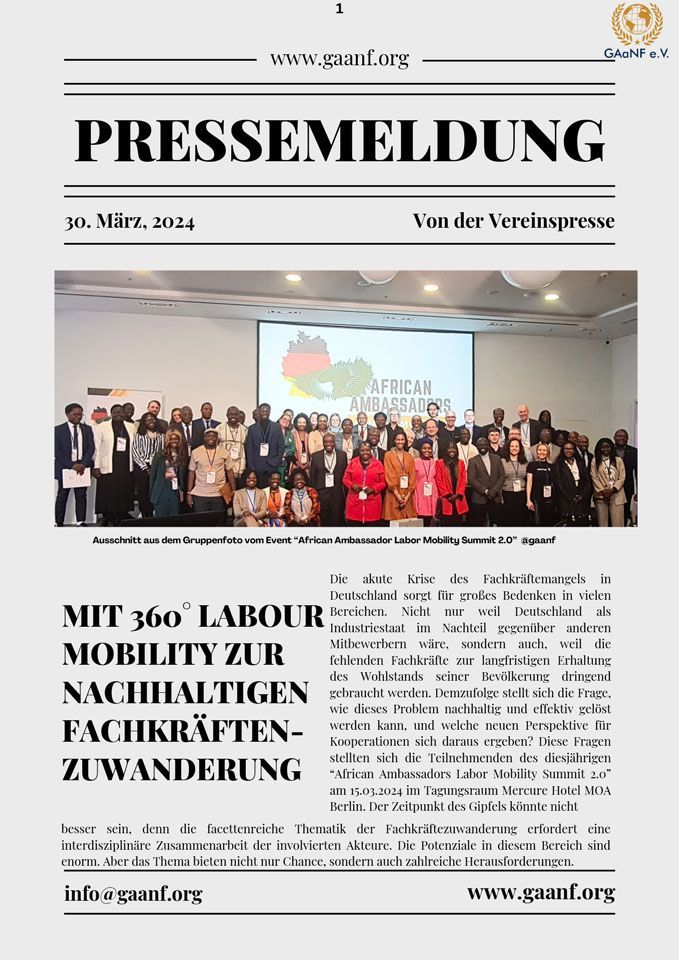 A group of people are standing in front of a large screen in a room.