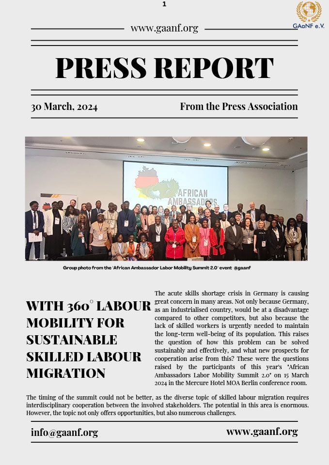 A group of people are standing in front of a large screen in a room.