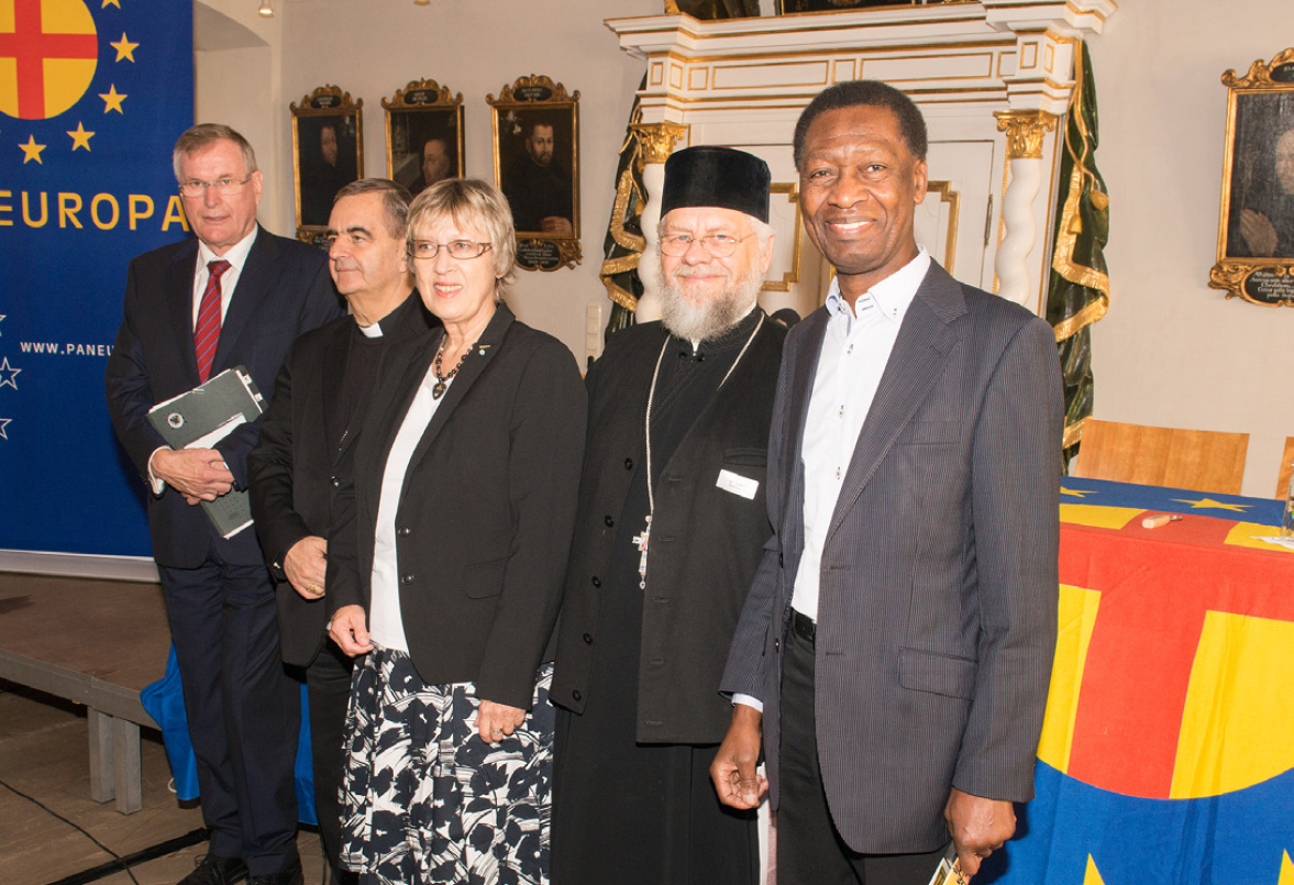 A group of people standing in front of a sign that says europa