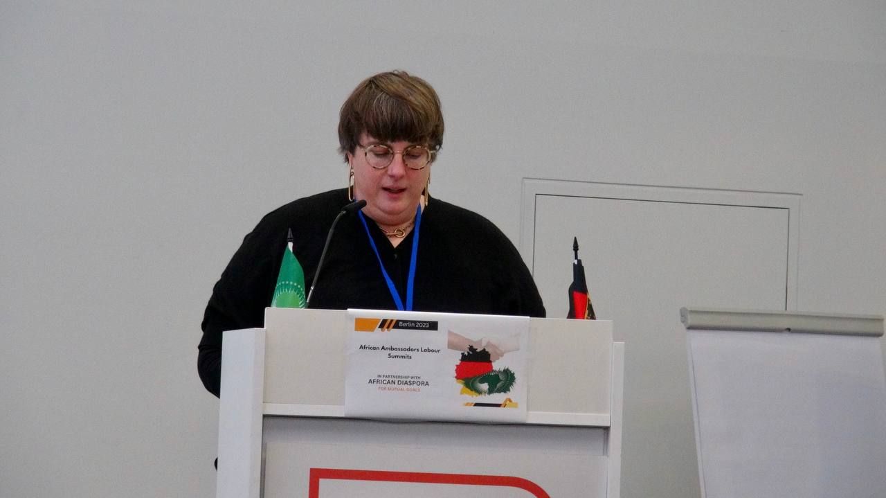 A man is standing at a podium giving a speech