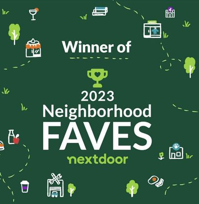 A green sign that says winner of neighborhood faves nextdoor