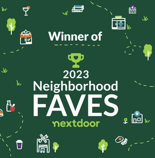 A green sign that says winner of neighborhood faves nextdoor