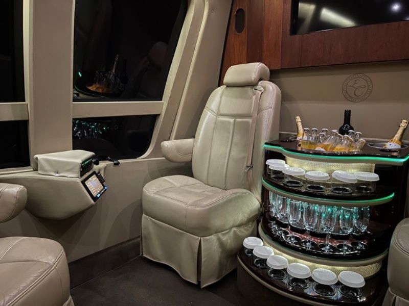 A car with a bottle of champagne and glasses on it