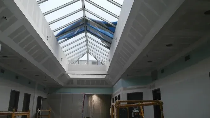 A building under construction with a skylight in the ceiling