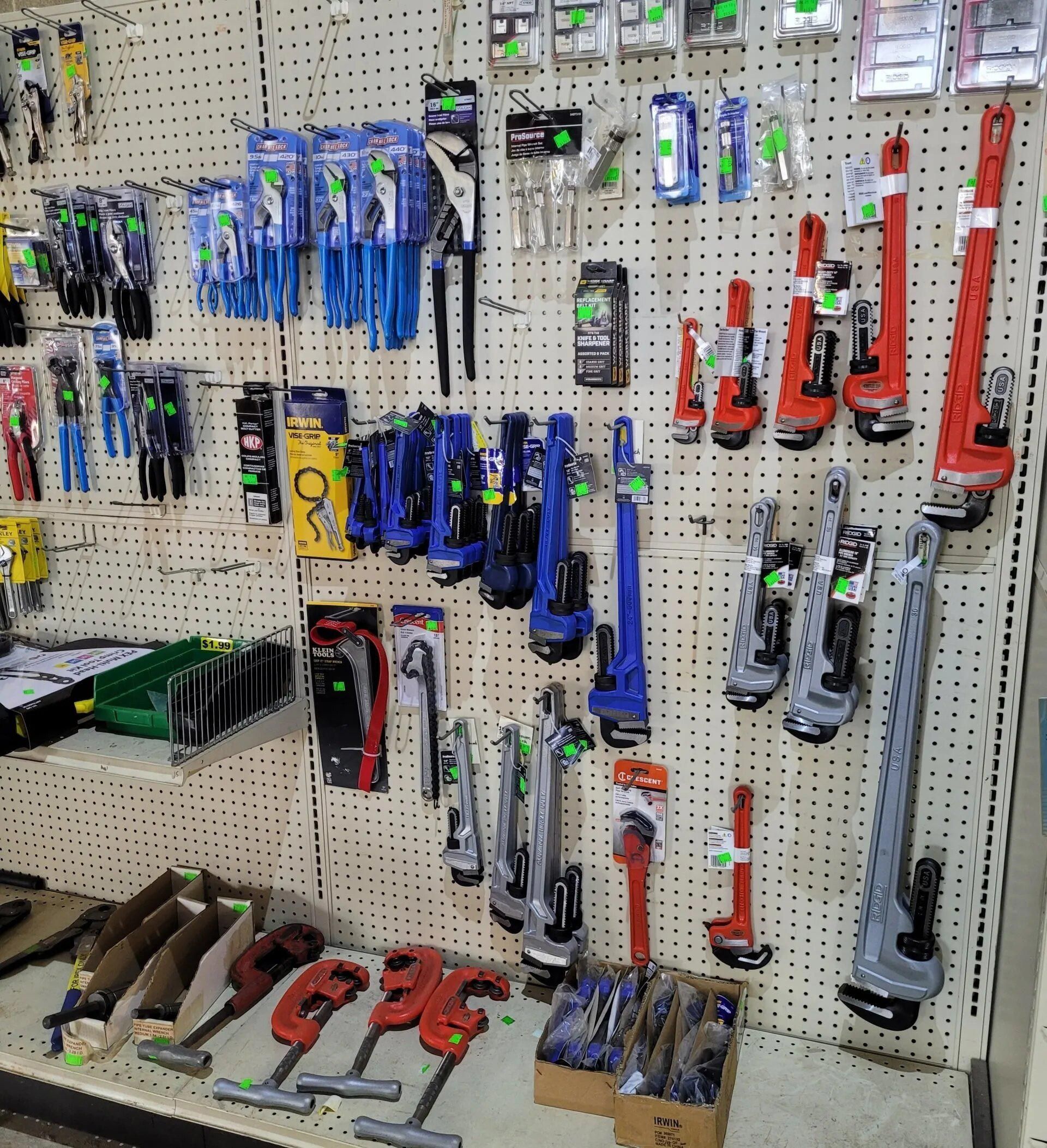 Bunch of Tools Are Hanging on a Wall — Hattiesburg, MS — McElhaney Plumbing & Hardware Inc