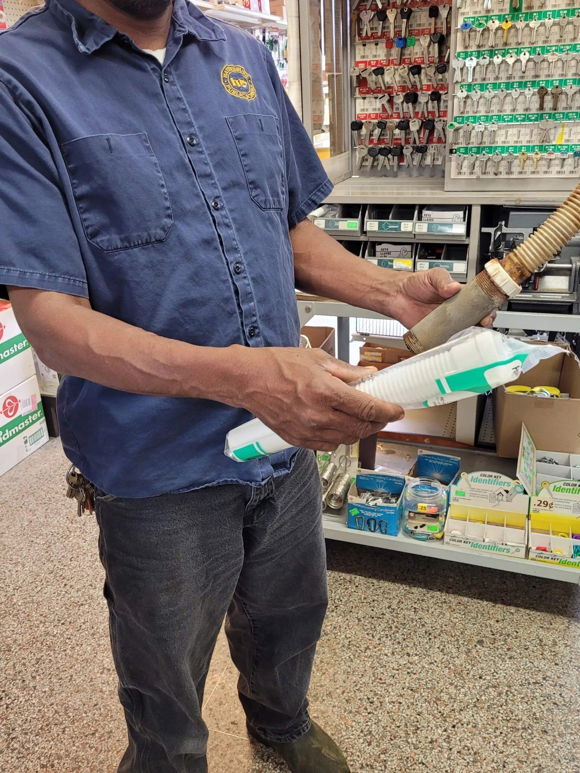 Man in a Blue Shirt — Hattiesburg, MS — McElhaney Plumbing & Hardware Inc