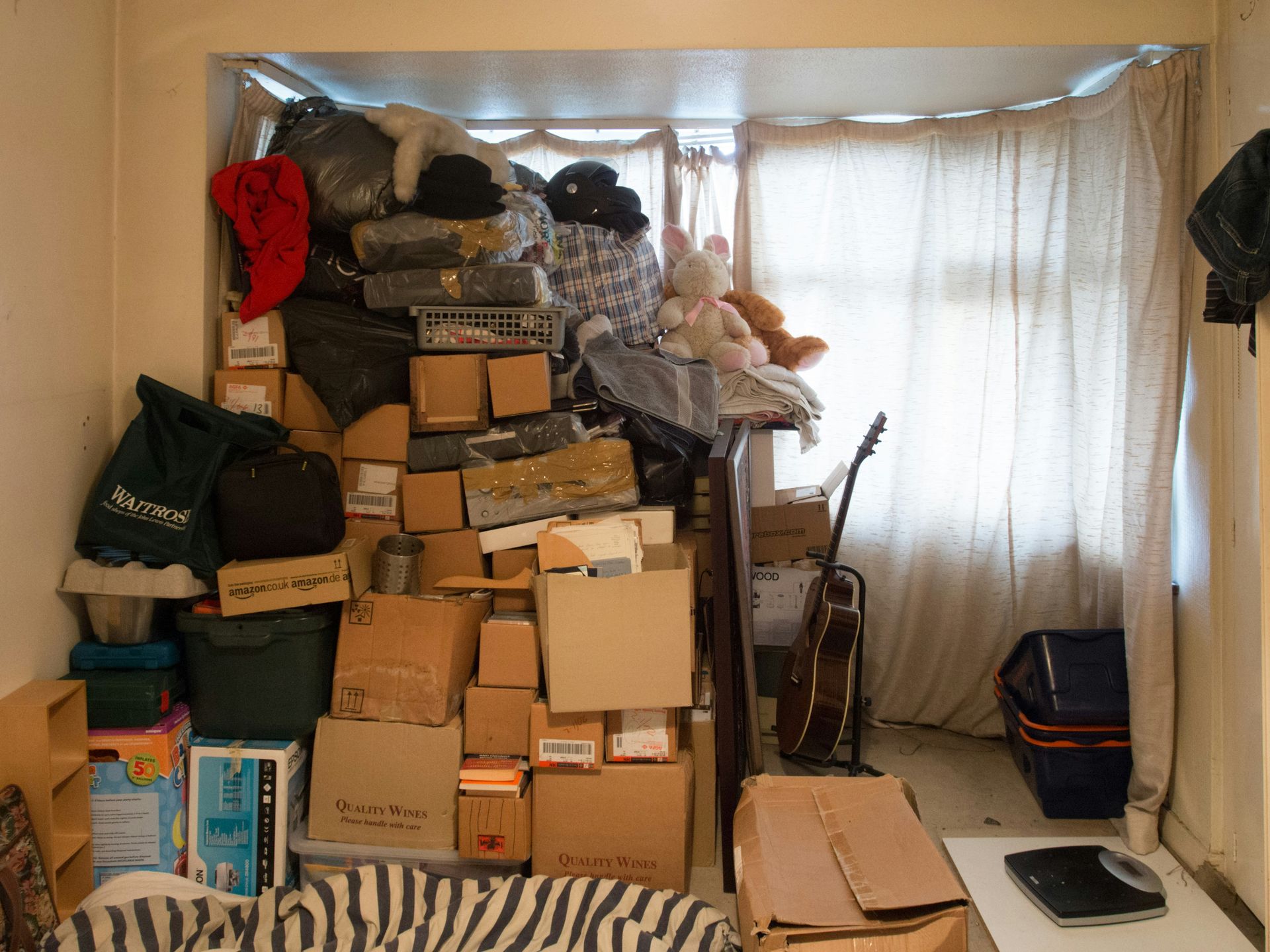 A room filled with lots of boxes including one that says ' jackson ' on it