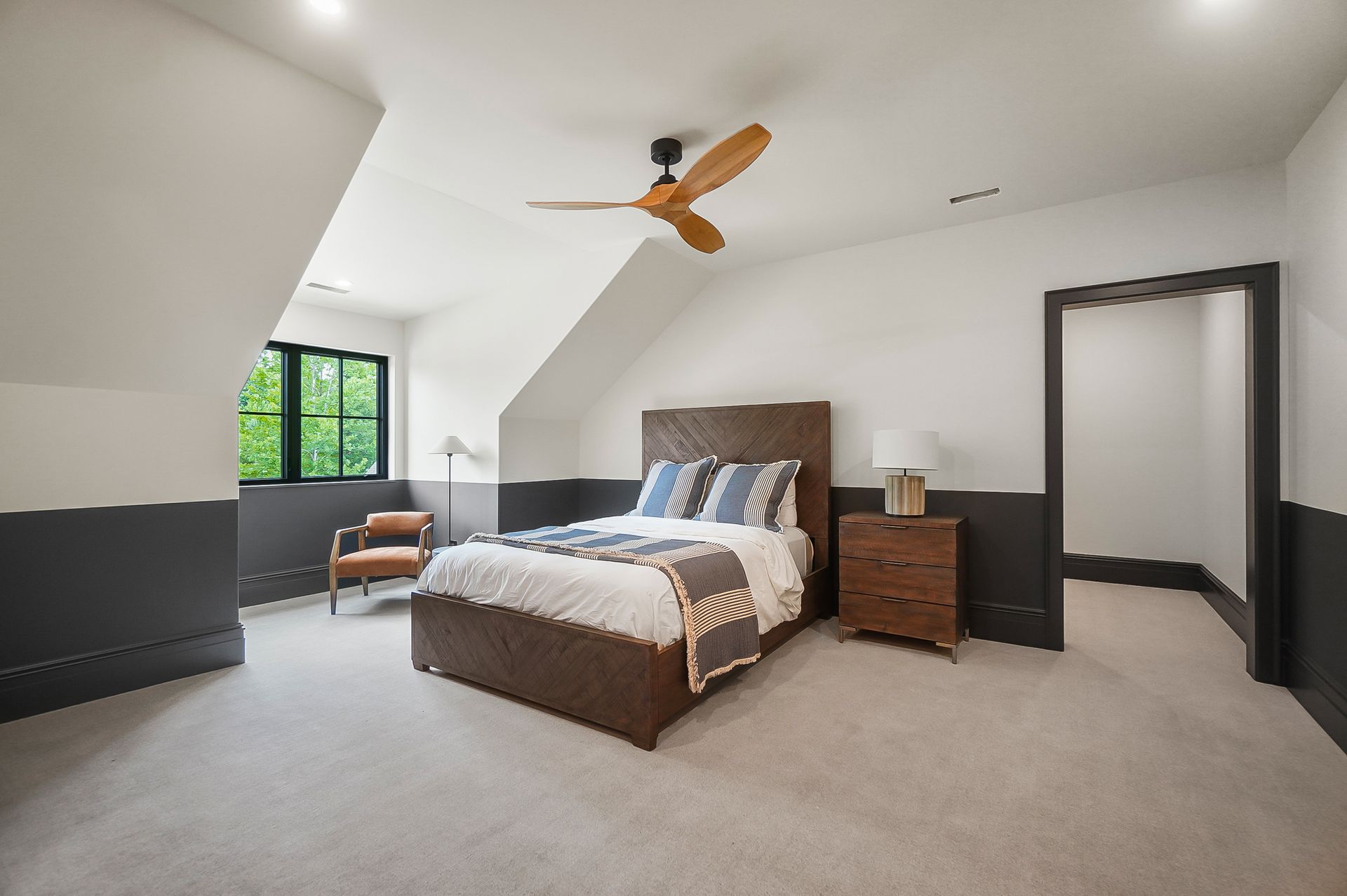 A living room filled with furniture and a ceiling fan