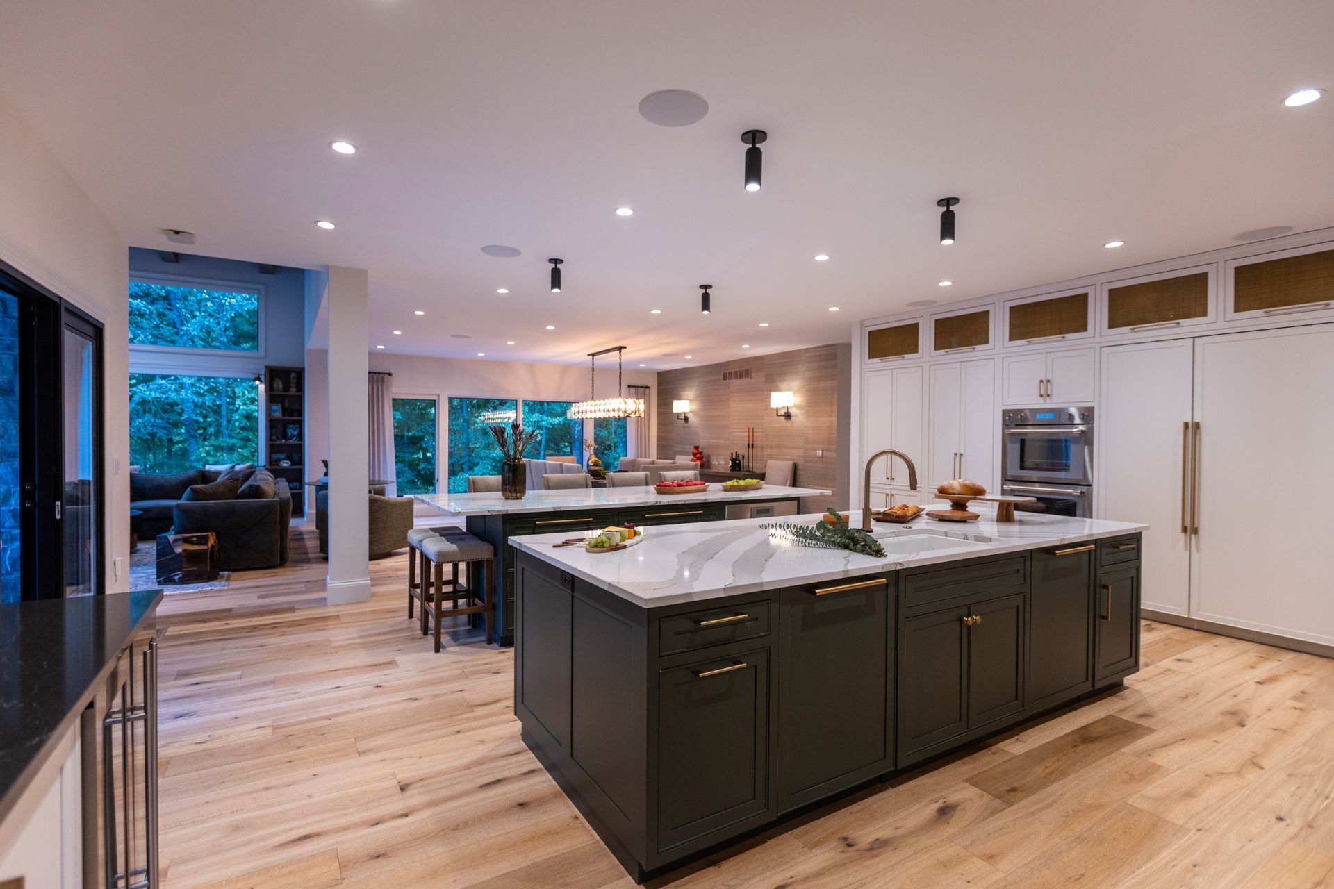 A kitchen with white cabinets and stainless steel appliances.