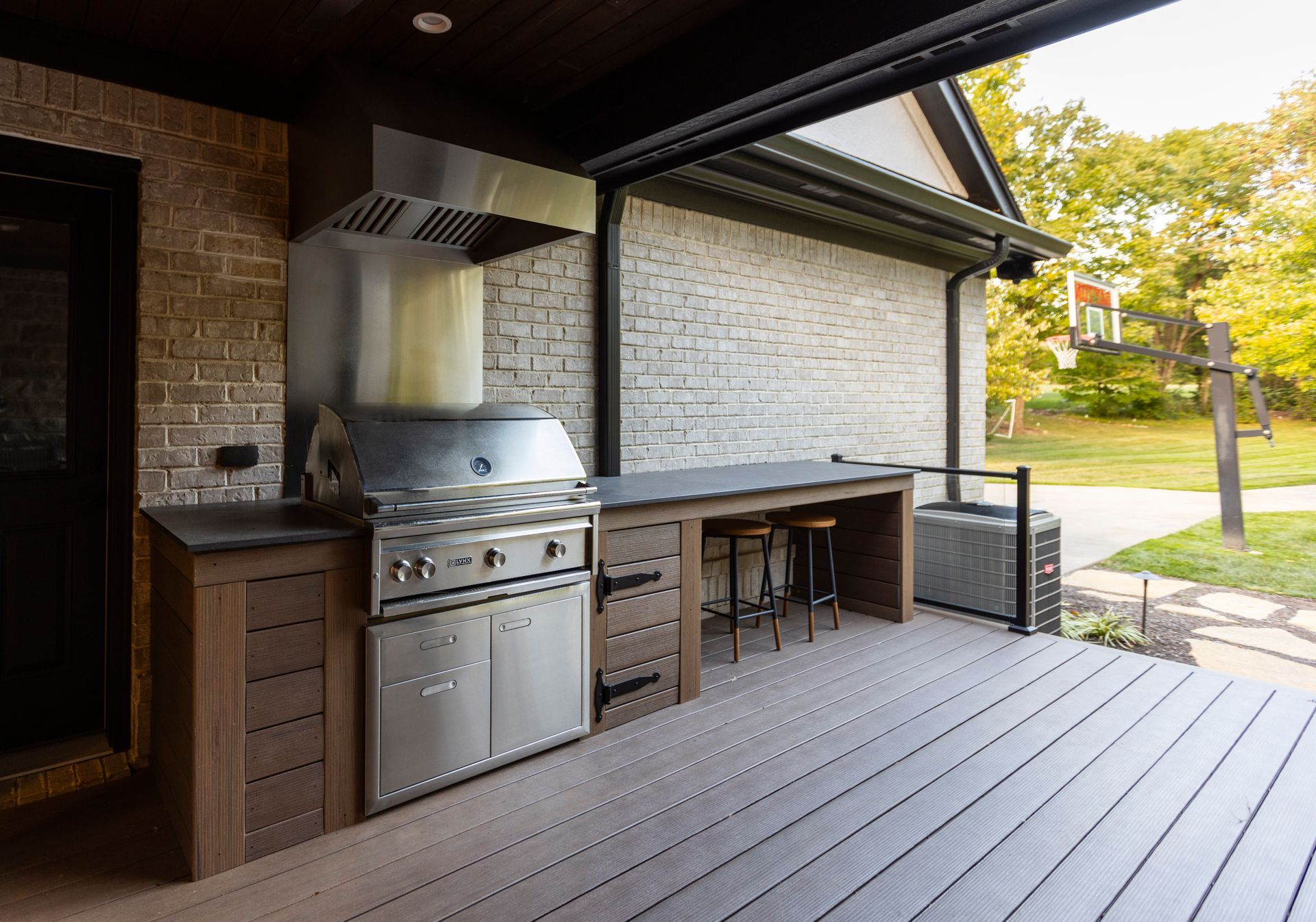 A kitchen with white cabinets and a stainless steel dishwasher.