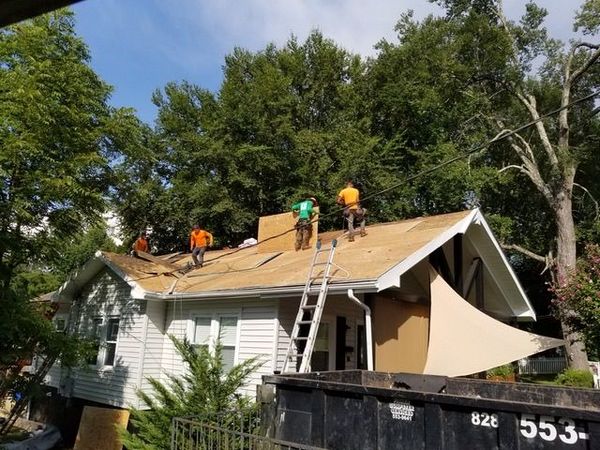 Mathis Roofing crew working on a residential roof in Asheville, NC