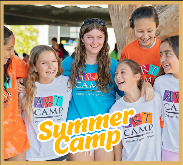 A group of young girls wearing summer camp shirts are posing for a picture