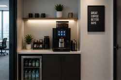 Modern coffee station with espresso machine, shelves, and a framed “Great coffee better days” sign