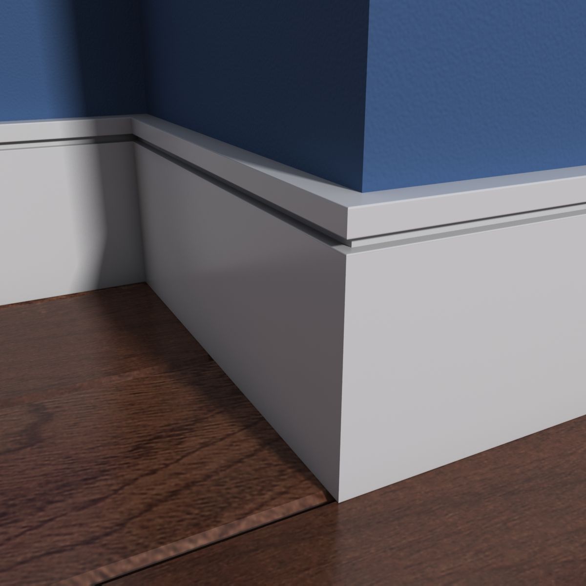 White baseboards meet at a corner, below a blue wall and above a wood floor.