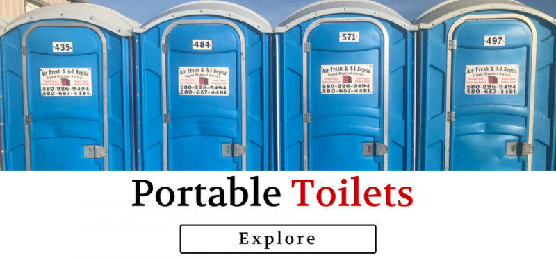 A row of four blue portable toilets with a button below labeled Explore.