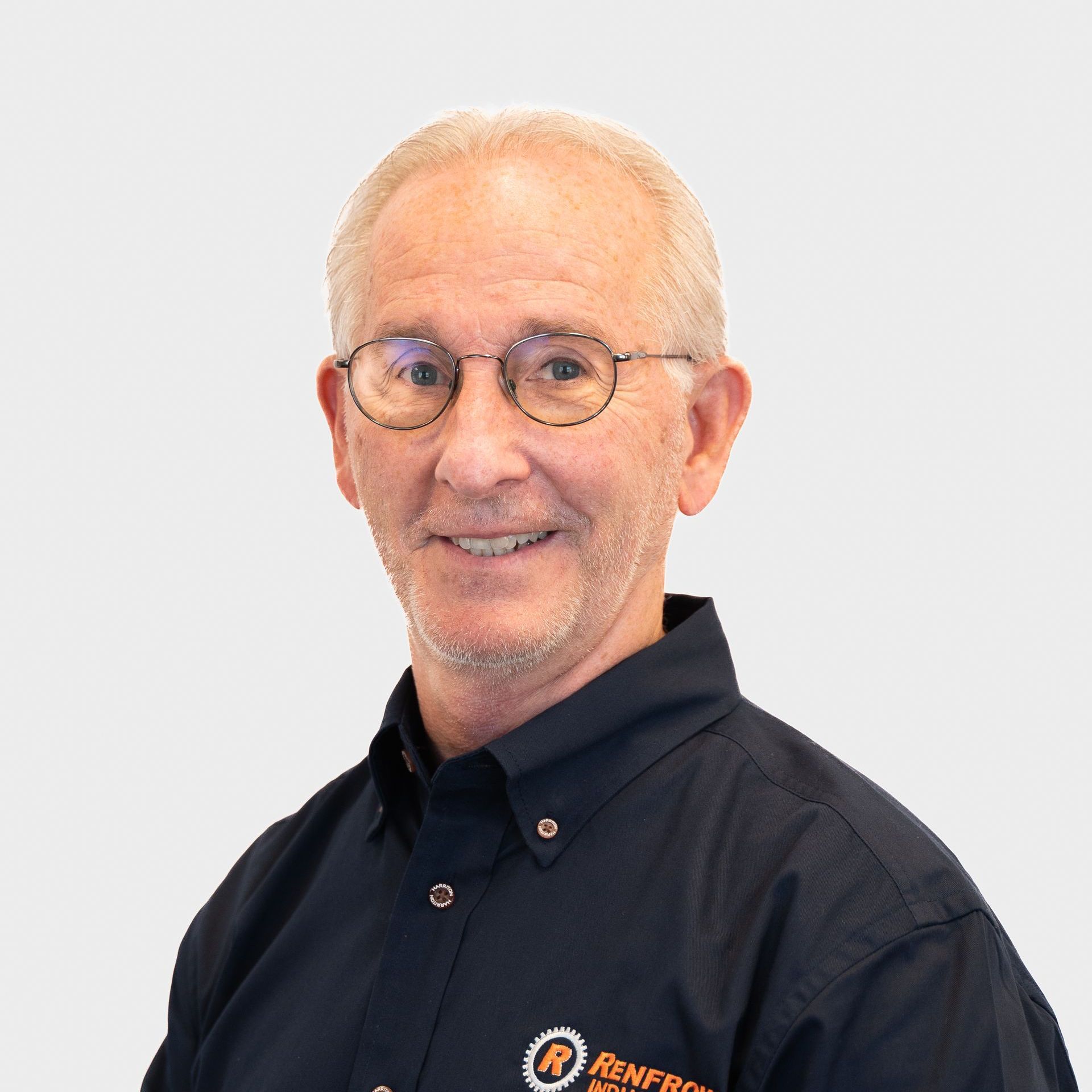 Man with glasses in a blue shirt, smiling; Renfro company logo visible.