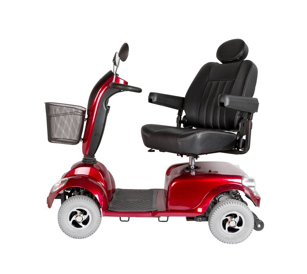 A Red Mobility Scooter with A Basket on The Front on A White Background — Toukley World of Bikes In Toukley, NSW