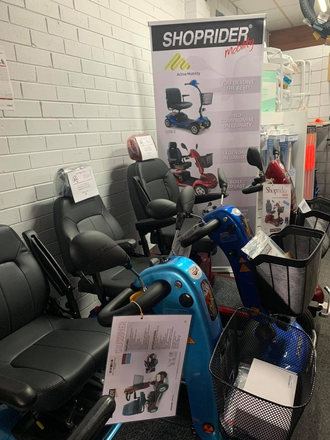 A Bunch of Scooters Are on Display in A Store — Toukley World of Bikes In Toukley, NSW