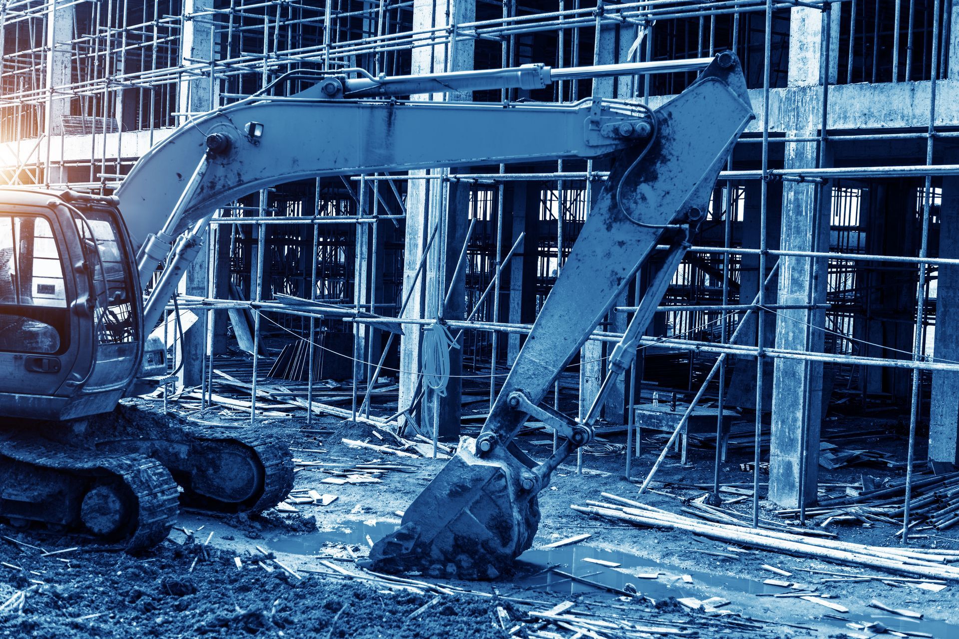 A large excavator is working on a construction site.