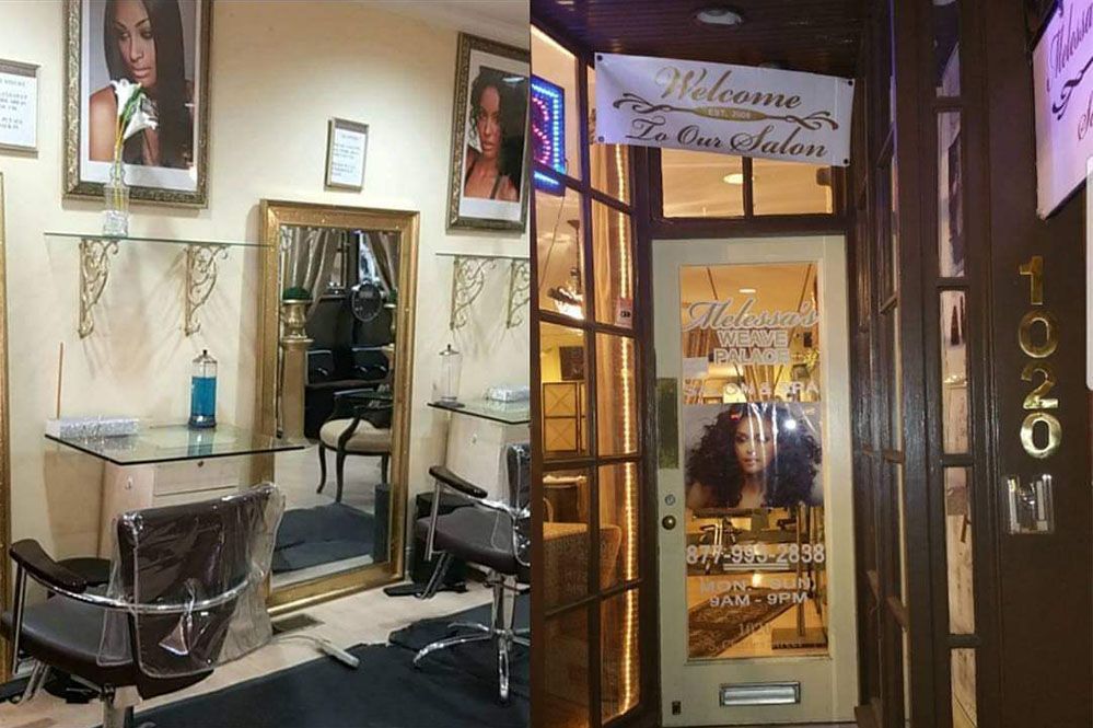 A picture of a hair salon with a chair and a mirror.