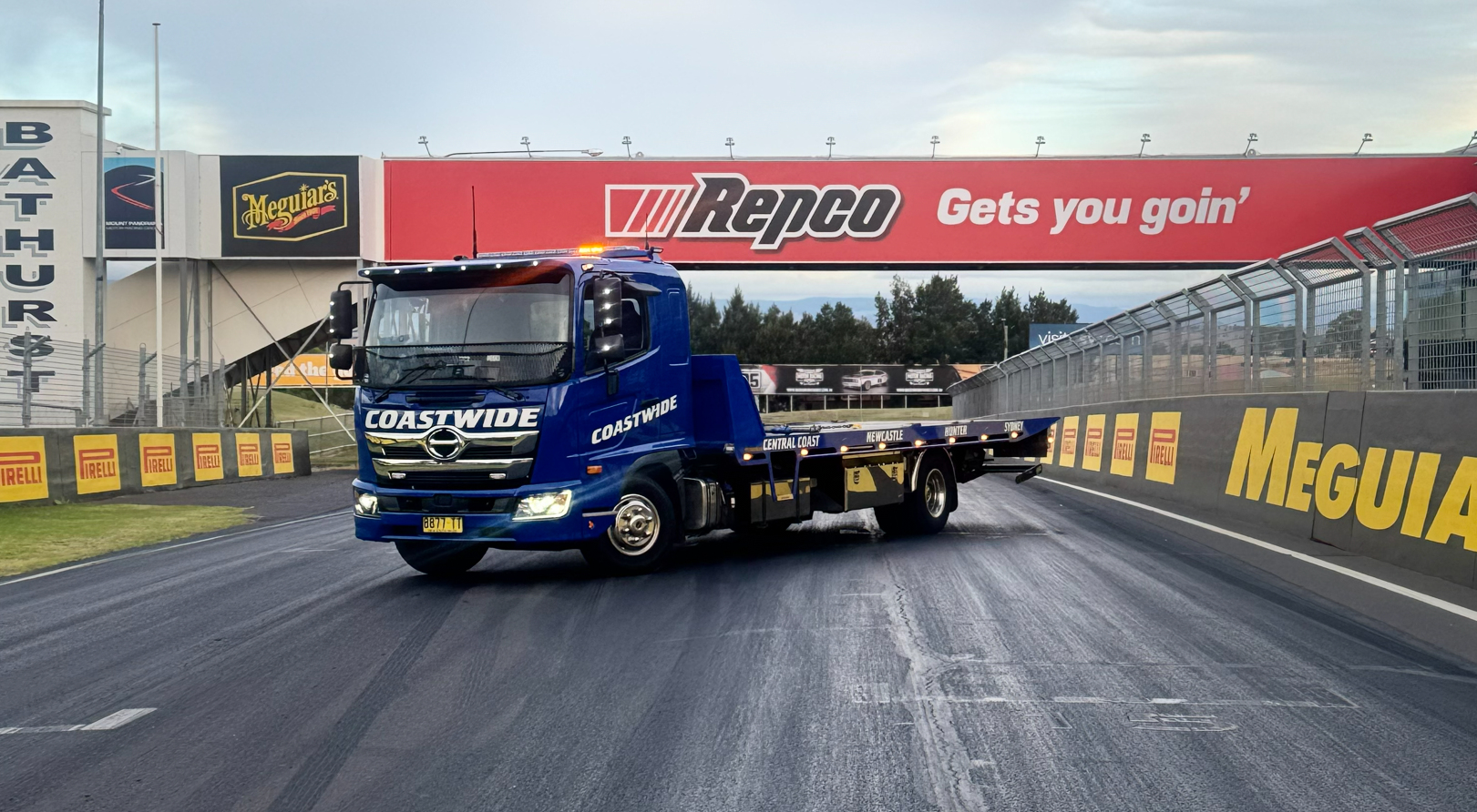 A Blue Coastwide Truck Is Parked On The Side Of The Road — Coastwide Towing & Transport In Berkeley Vale, NSW