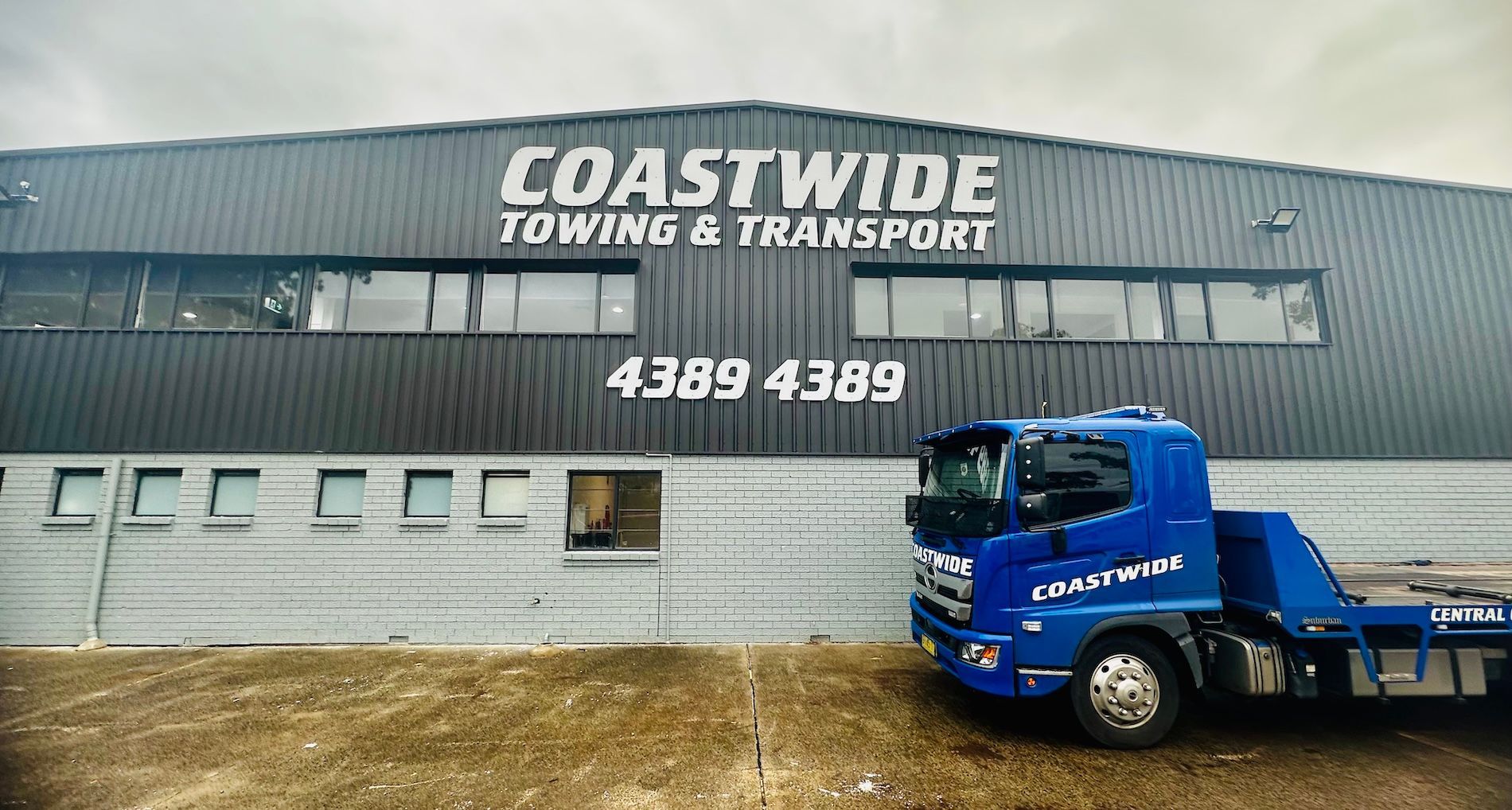 A Blue Tow Truck With A Red Tractor — Coastwide Towing & Transport In Berkeley Vale, NSW