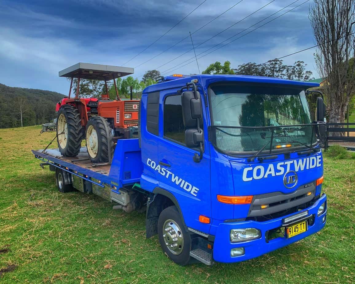 A Blue Tow Truck With A Red Tractor — Coastwide Towing & Transport In Berkeley Vale, NSW