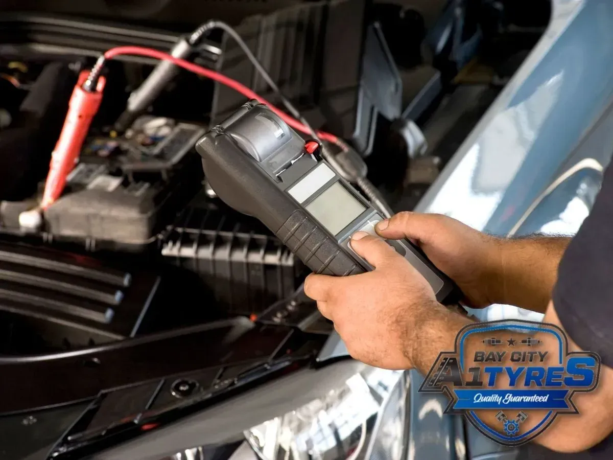 Hands Using a Diagnostic Tool on A Car Engine in An Open Hood Area — Bay City A1 Tyres in North Geelong, VIC