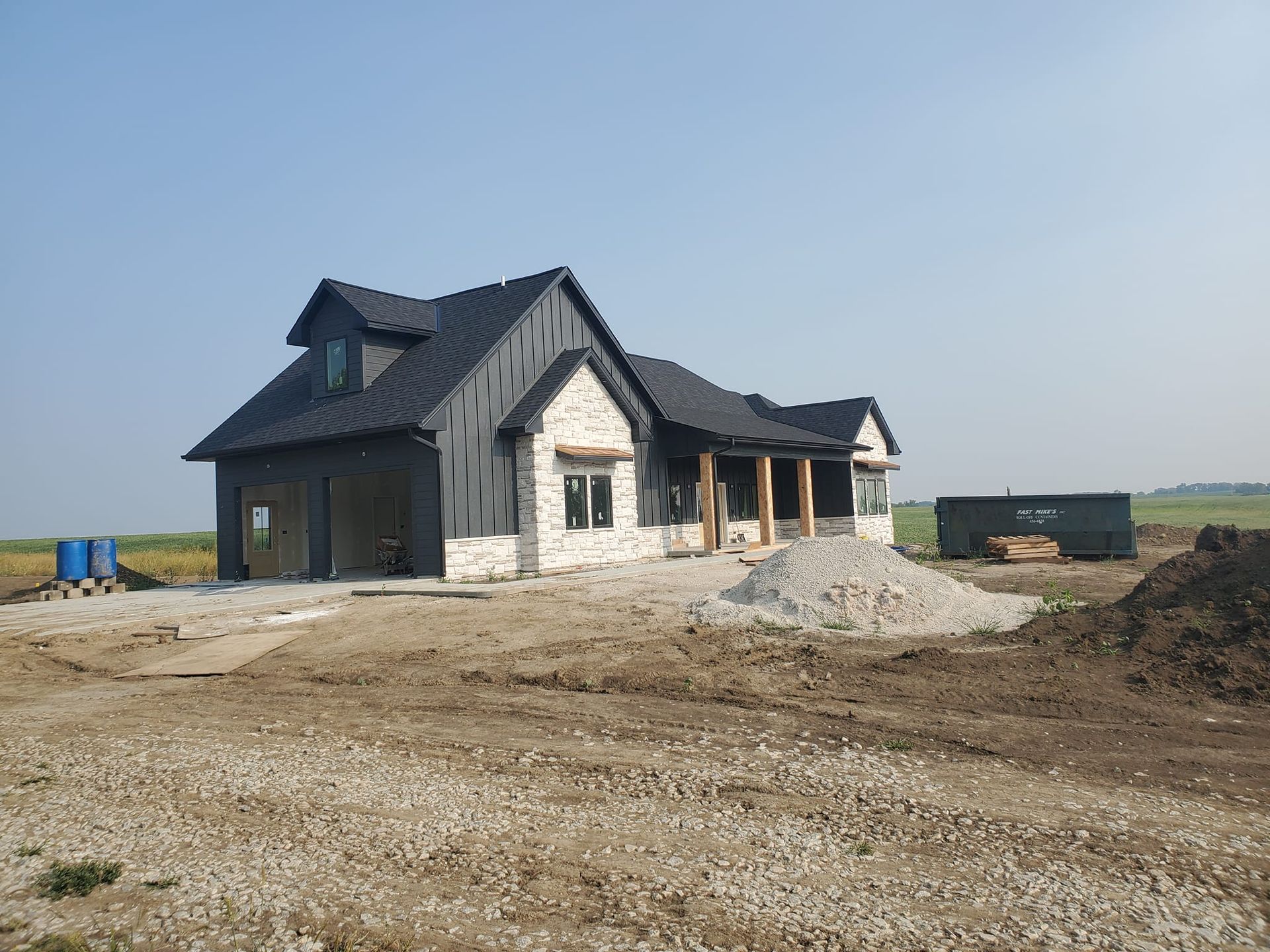 A house is being built in the middle of a dirt field. Independence Built Custom Home Builder in Nebraska