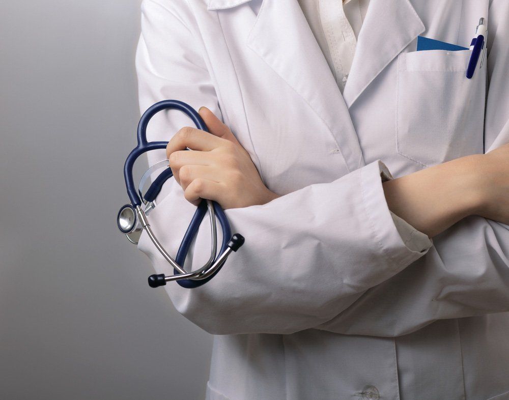 Closeup Of Female Doctor's Hand Holding Stethoscope — Deception Bay Doctors In Deception Bay, QLD