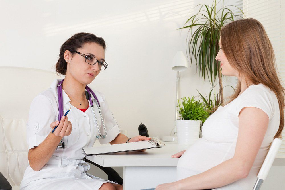Pregnant Woman Visiting Doctor — Deception Bay Doctors In Deception Bay, QLD